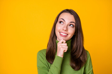 Close-up portrait of pretty smart clever creative cheerful girl creating new solution copy space guess isolated on vivid yellow color background