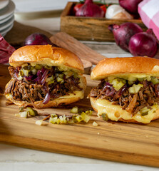 Cheeseburger with delicious pulled and roasted beef, caramelized red onions, pickles and swiss cheese