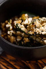 Broken cucumber salad with cashew nuts. Pan-Asian cuisine concept. Close-up.