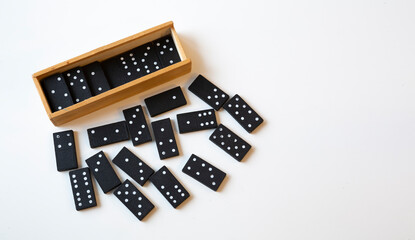 Wooden domino box standing on isolated white background