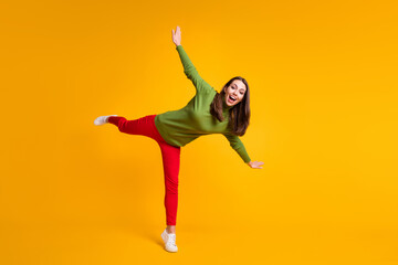 Fototapeta na wymiar Full length body size view of nice overjoyed cheerful girl jumping having fun isolated on bright yellow color background