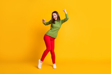 Full length body size view of pretty slender funky cheerful girl dancing having fun chill rest isolated bright yellow color background