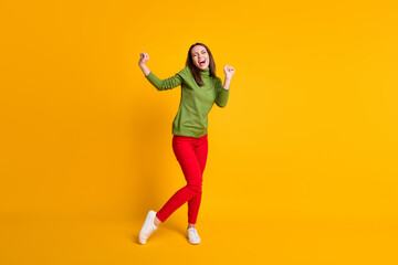 Full length body size view of attractive ecstatic cheery girl dancing having fun celebrating isolated bright yellow color background