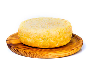 Tasty and big  typical spanish omelette on a wooden tray on white background