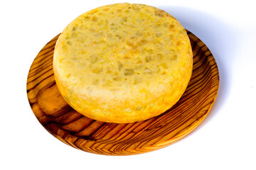 Tasty and big  typical spanish omelette on a wooden tray on white background