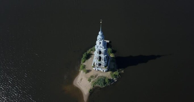 4K high quality aerial video footage of partly submerged Nikolskiy/St. Nicholas Сathedral bell tower off the shore Kalyazin town on great Volga River, Golden Ring route 200 km from Moscow, Russia