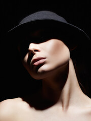 Beautiful woman in hat. Retro style portrait