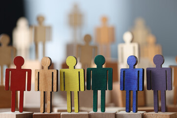 Wooden little men in lgbt colors. Sex minorities and their lifestyle concept