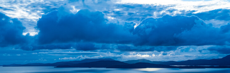picturesque view on sea coastline and cloudy sunset sky	