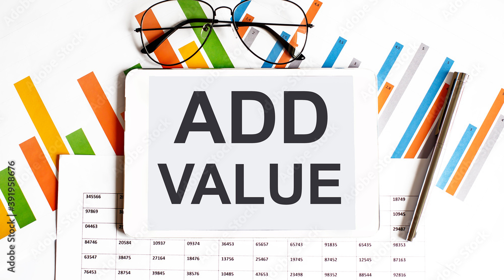 Poster the tablet with text add value on the business charts and pen