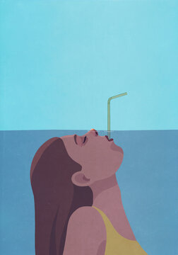 Woman underwater breathing through straw
