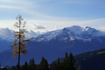 view to the alps in the morning with sun and blue sky in autumn