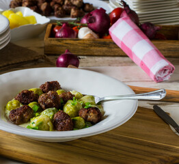 fried meatballs with vegetables on a plate