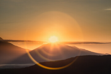 Fototapeta na wymiar Kamchatka, reflection of the sun's rays on the camera lens