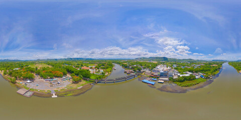360 panorama by 180 degrees angle seamless panorama of aerial view of River Kwai Bridge with train rail way with Chao Phraya River, Tha Ma Kham, Mueang Kanchanaburi District, Thailand.