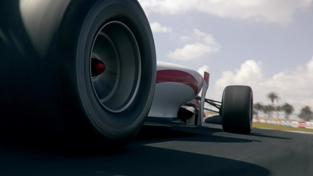 Dynamic rear view shot of a generic formula one race car driving along the race track - realistic high quality 3d animation - my own car design - no copyright/trademark infringement