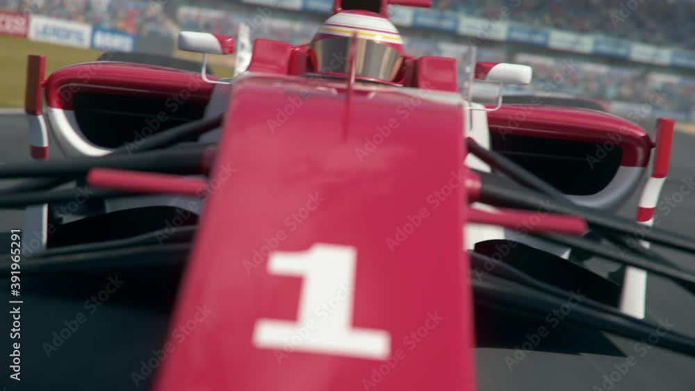 Poster dynamic front view shot of a formula one race car driving around a curve with grandstands in backgro