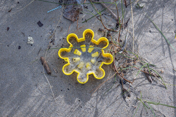 Lost plastic sand toy on Baltic Sea beach on Vistula Spit between Vistula Lagoon and Bay of Gdansk, near Katy Rybackie village, Poland