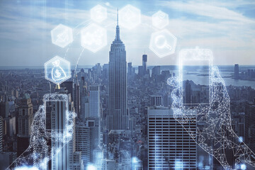 Double exposure of technology theme hologram and cityscape background. Concept of Hightech.