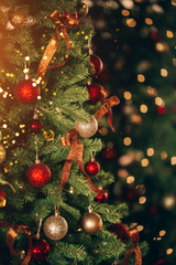 Beautiful and decorated Christmas tree in the mirror reflection. Christmas mood. Great photo for greeting cards