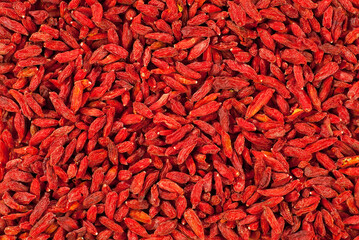 Goji berries close up. Lots of red berries in a pile. Goji texture.