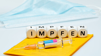 Vaccination, syringe with vaccination certificate
