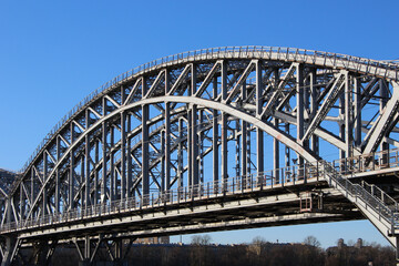 Naklejka premium Close-up of the arched span of the railway two-track bridge