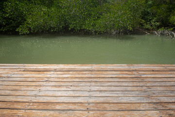 Obraz premium Wooden pier with view to tropical water at mangrove forest