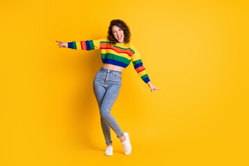 Fototapeta na wymiar Full length photo of funky girl dance open mouth wear striped cropped pullover jeans sneakers isolated yellow color background