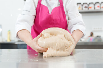 Step-by-step Easter cake, pastry chef prepares dough with raisins for festive kulich