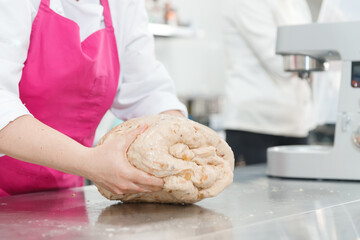 Step-by-step Easter cake, pastry chef prepares dough with raisins for festive kulich
