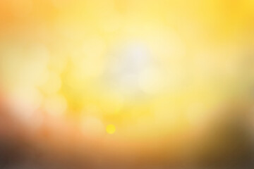 Hope concept; Abstract blurred sunrise background blurring warm colors calm bright sunlight. Sky...
