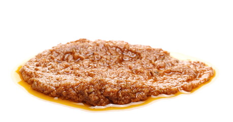 Tomato dressing sauce with basil isolated on white background