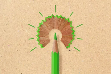 Foto op Canvas Green pencil like a light bulb on recyced paper background - Concept of ecology and creative thinking © calypso77