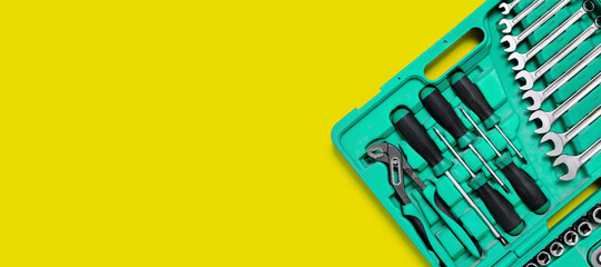 Green set of construction tools: wrenches, adjustable pliers, screwdriver and so on yellow...