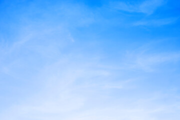 Blue sky background and white clouds soft focus, and copy space