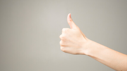 Female hands thumbs up