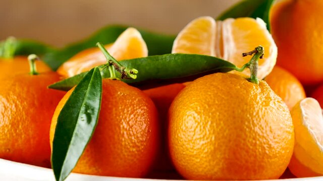 mandarin fruit, clementine and leaf rotating