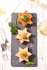 festive canape with foie gras and wine