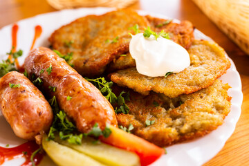 belarusian pancakes with sausages in a restaurant