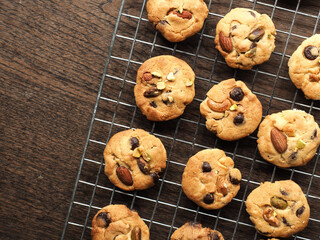 Top view chocolate chip and mixed nut cookies on wooden table