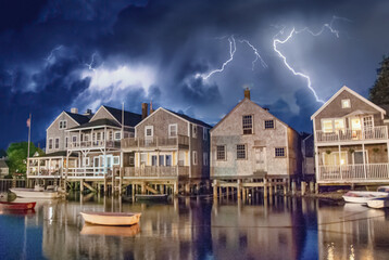 Storm approaching beautiful wooden homes over the sea