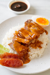 crispy pork on rice with barbecue sauce