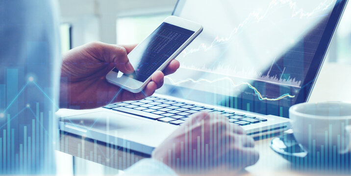 Business man analysis on digital stock market financial background. Stock market financial analysis on smartphone and computer screens,stock market financial concept.Double exposure - Powered by Adobe