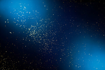 Golden abstract bokeh on dark blue background. Holiday concept