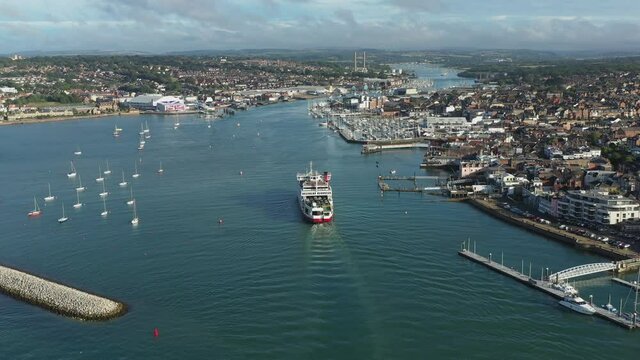 Slow tracking shot of car ferry entering a sailing port, on the Isle of Wight 4K