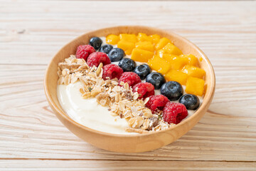 homemade yogurt bowl with raspberry, blueberry, mango and granola