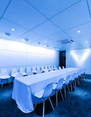 An indoor conference room with blues scenes