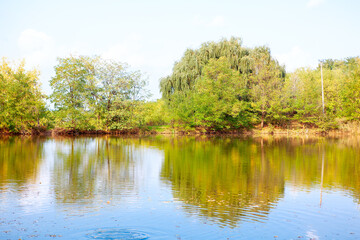 Fototapeta na wymiar Idyllic scenery with lake . Nature reflection in the river water 