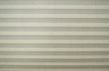 New white accordion fold cardboard wtih many lines close